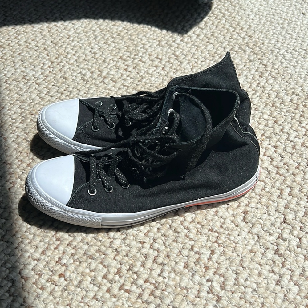 Men’s black and white Converse, size 11
